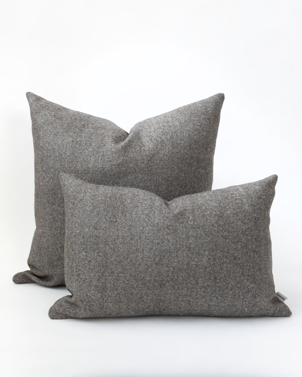 Two charcoal grey pillows.