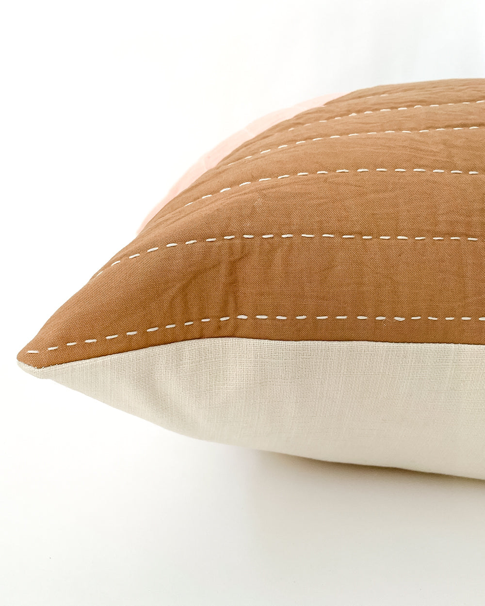Close up detail of Dunne Quilted Cotton Pillow in black, green, pink and brown