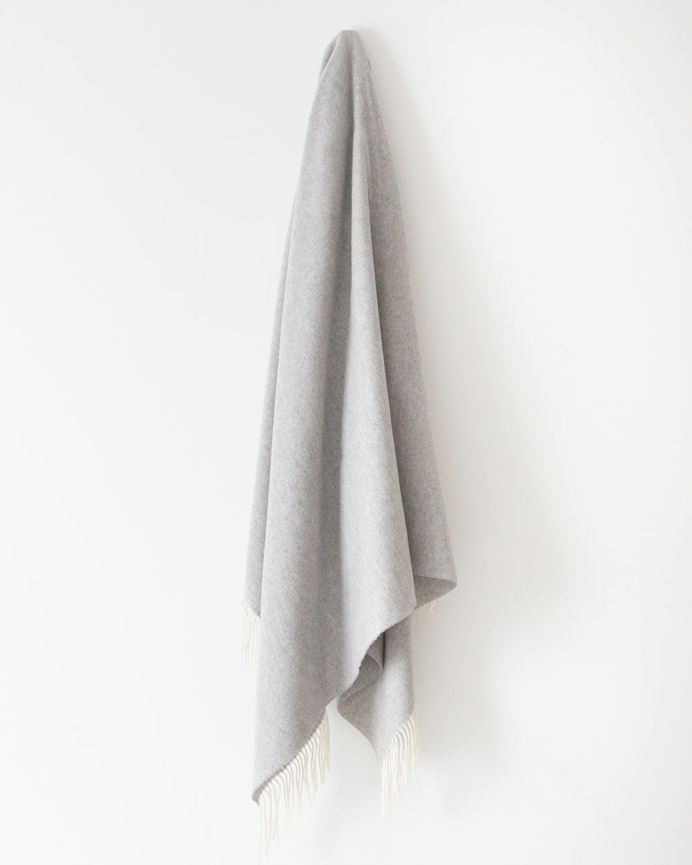 Hanging Haliburton grey wool throw with fringe