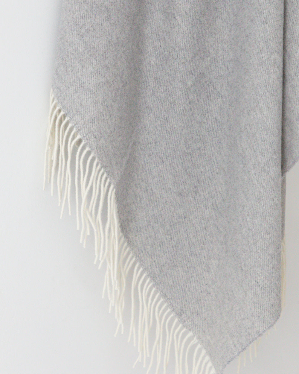 Close up detail of Haliburton grey wool throw with fringe