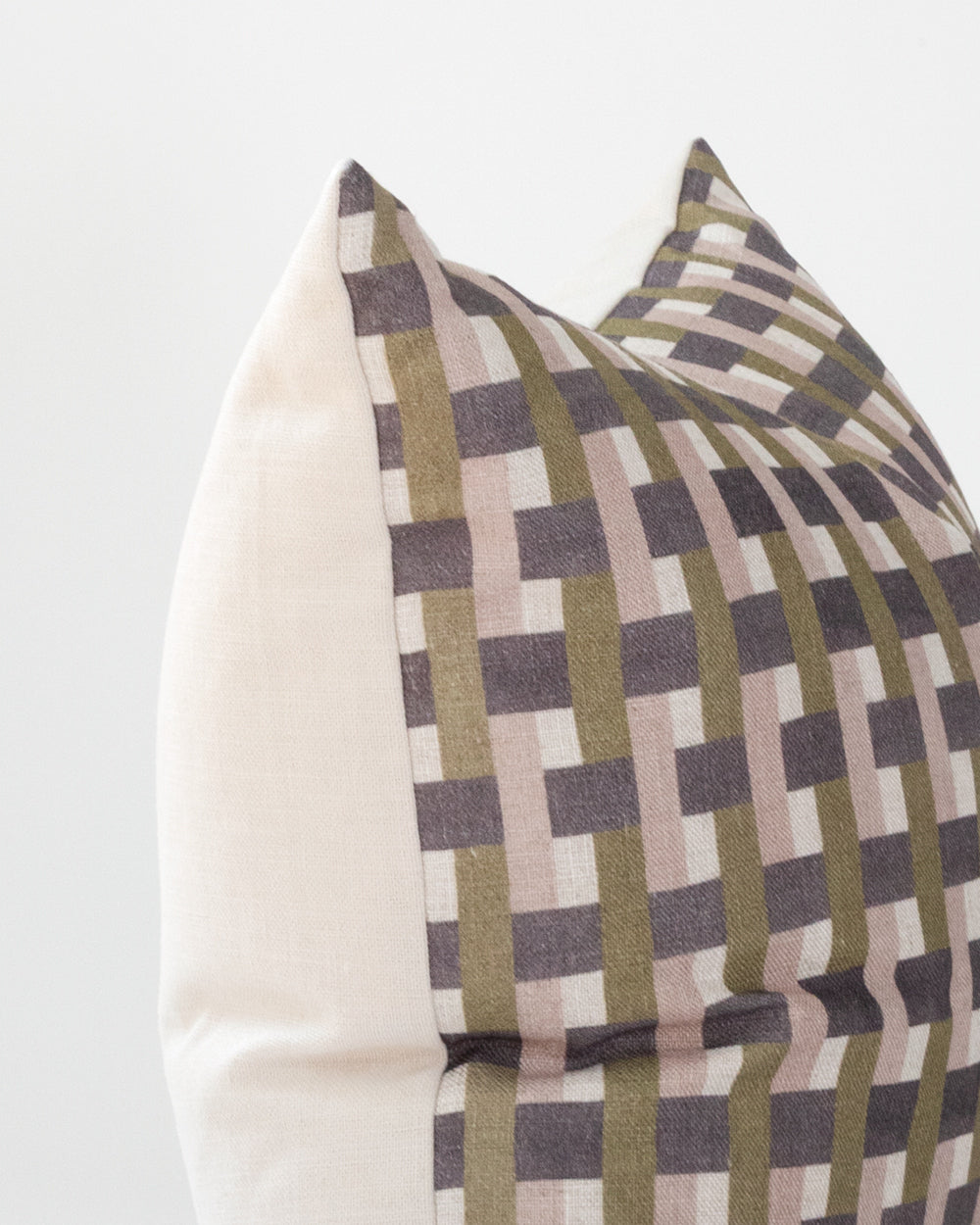 Close up detail of Plum, mauve and olive green check printed pillow