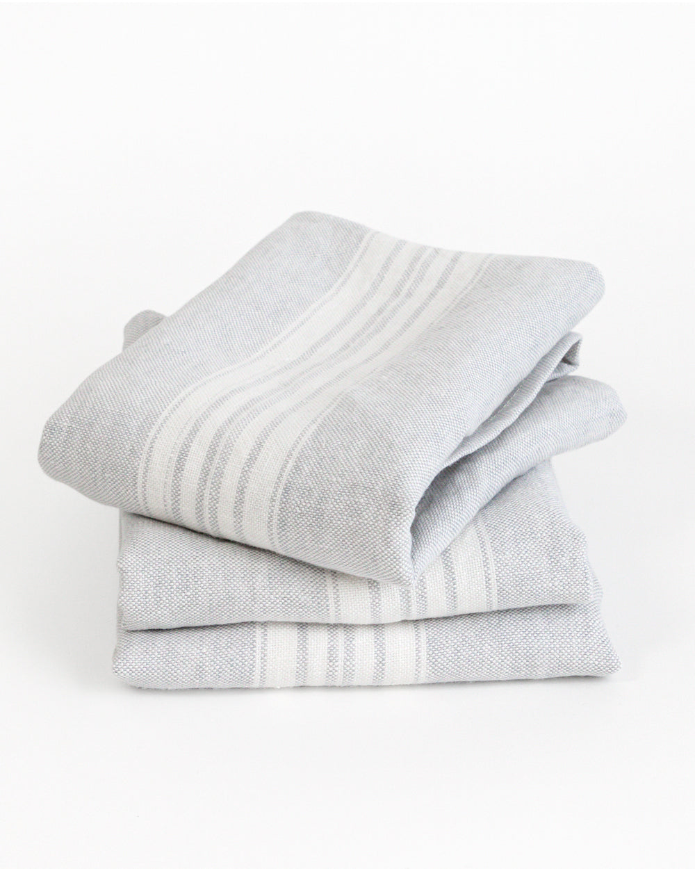 Stack of stone-washed linen tea towels is a soft, pale grey with a white stripe