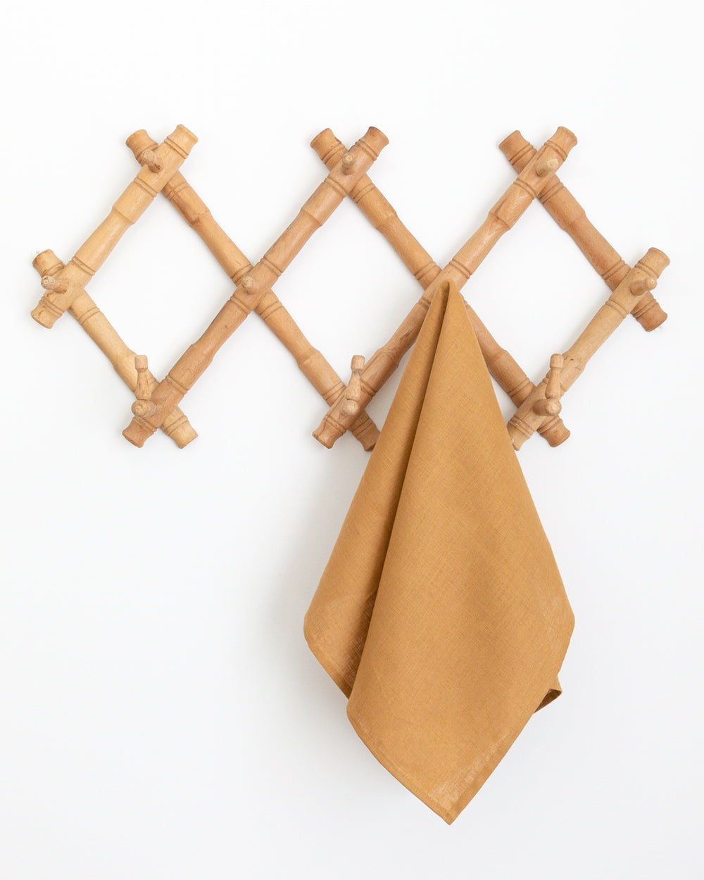 Hanging linen tea towel in brown earth-tone