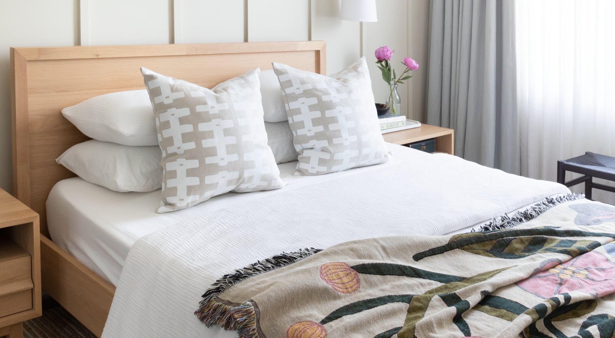 Hemme styled bedroom with Hemme pillows and floral quilt