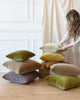 multiple piles of different colour mohair pillows