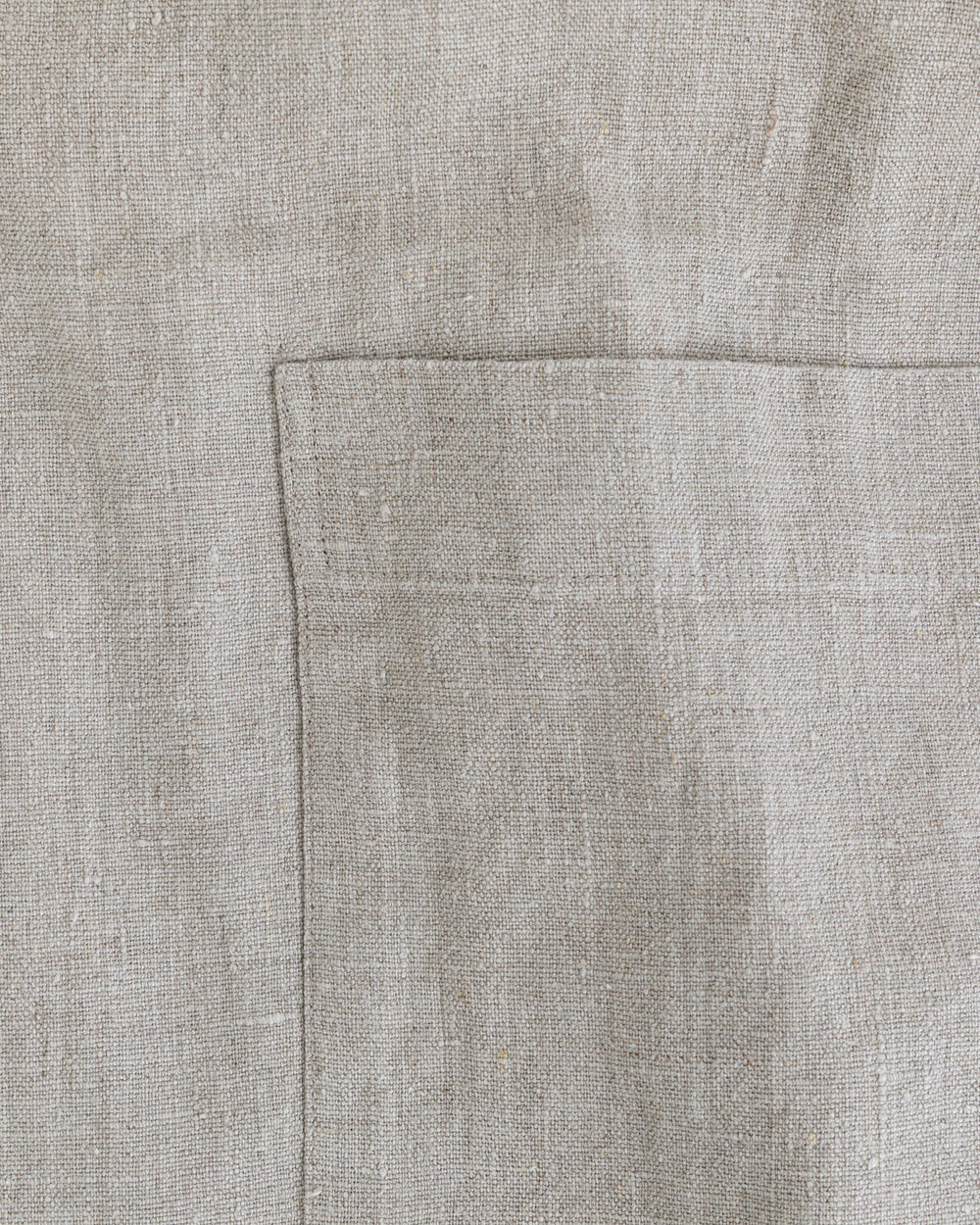 Close up detail of natural stone-washed linen apron