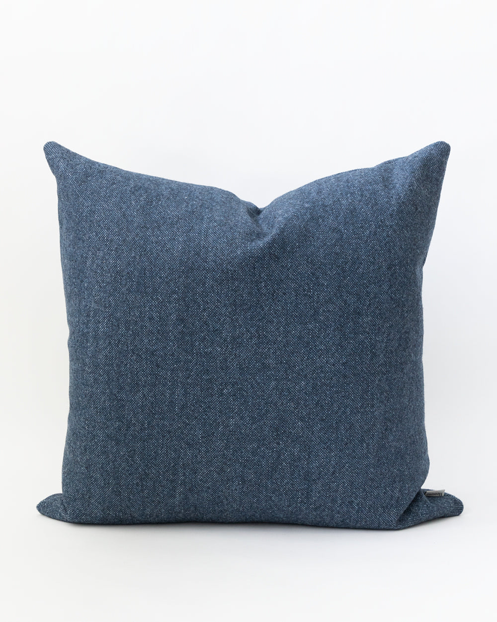 Square inky blue wool pillow.