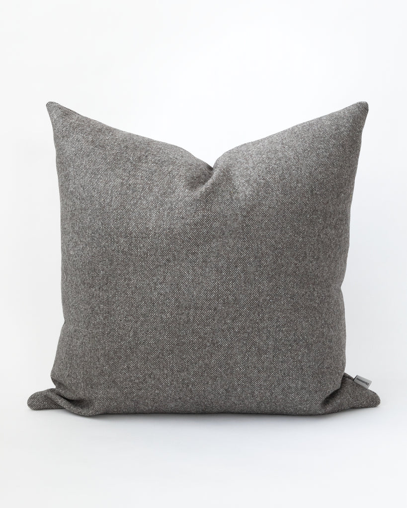 Square charcoal grey pillow.