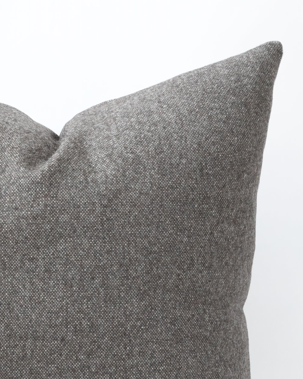 Detailed close up of charcoal grey pillow.