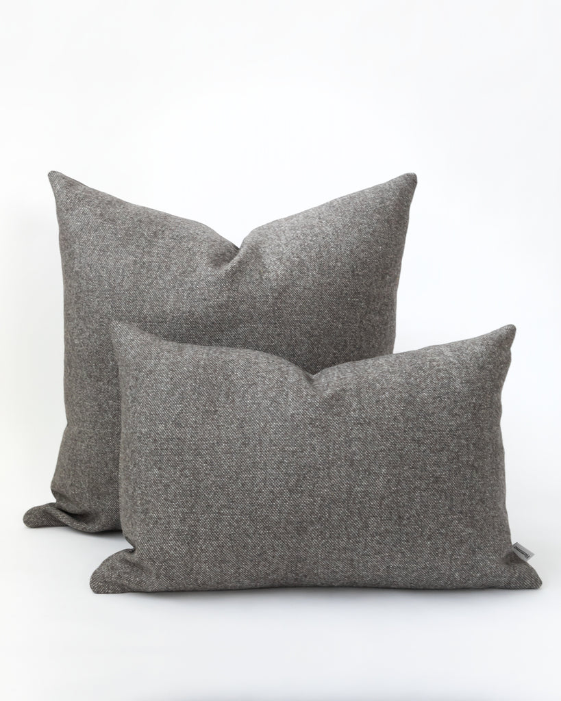 Two charcoal grey pillows.