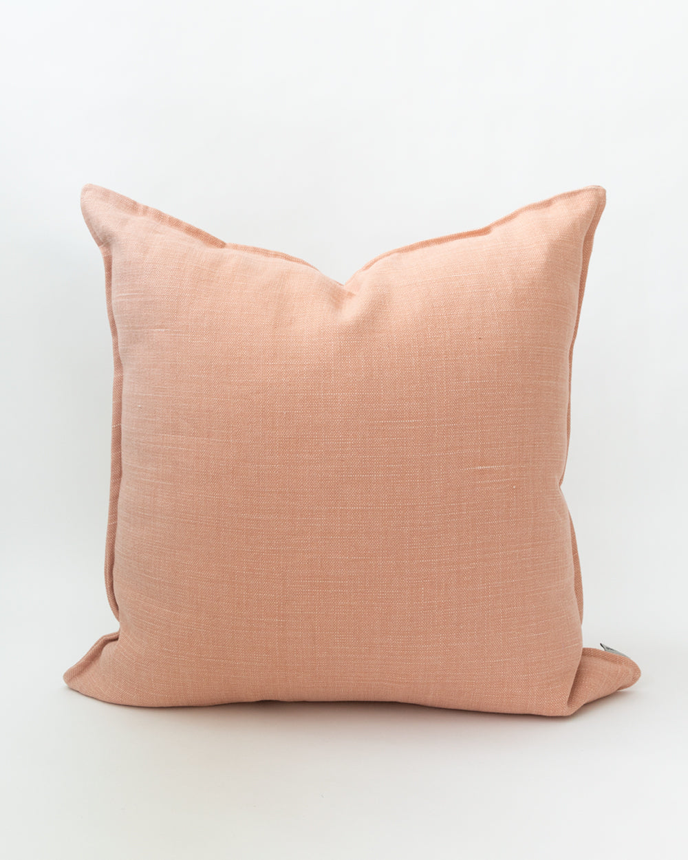 Square solid pink linen pillow.