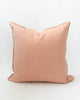 Square solid pink linen pillow.
