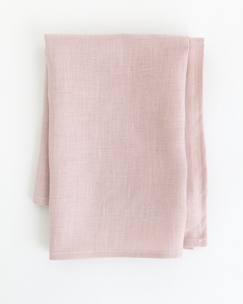 Flat folded Light pink linen tea towel.
