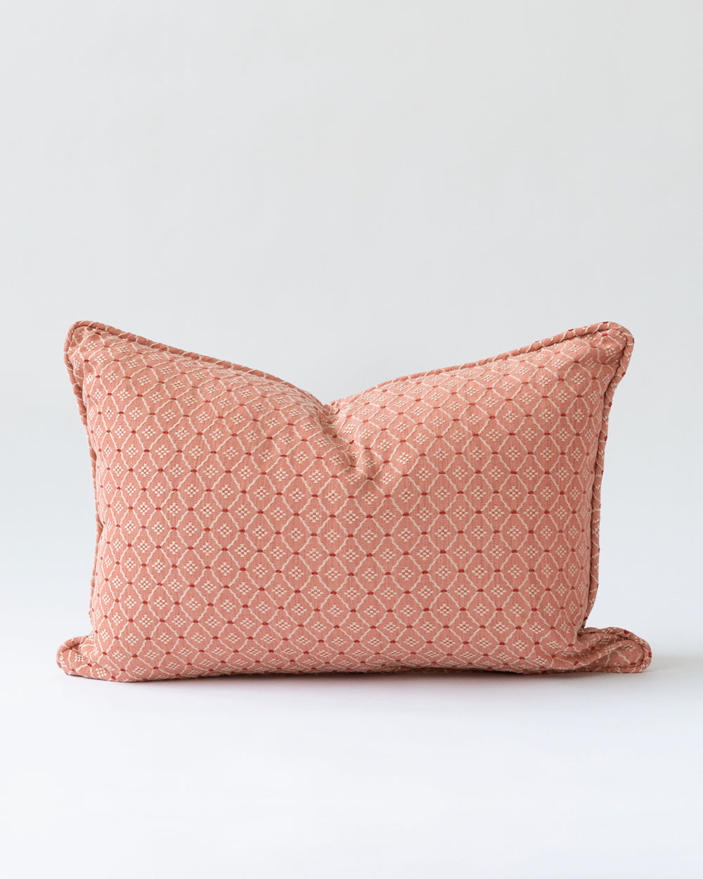 Embroidered pink pillow.