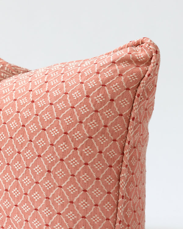 Close up detail of embroidered pink pillow