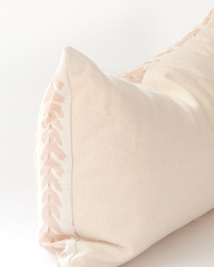 Detail close up of blush linen botanical stripe lumbar pillow