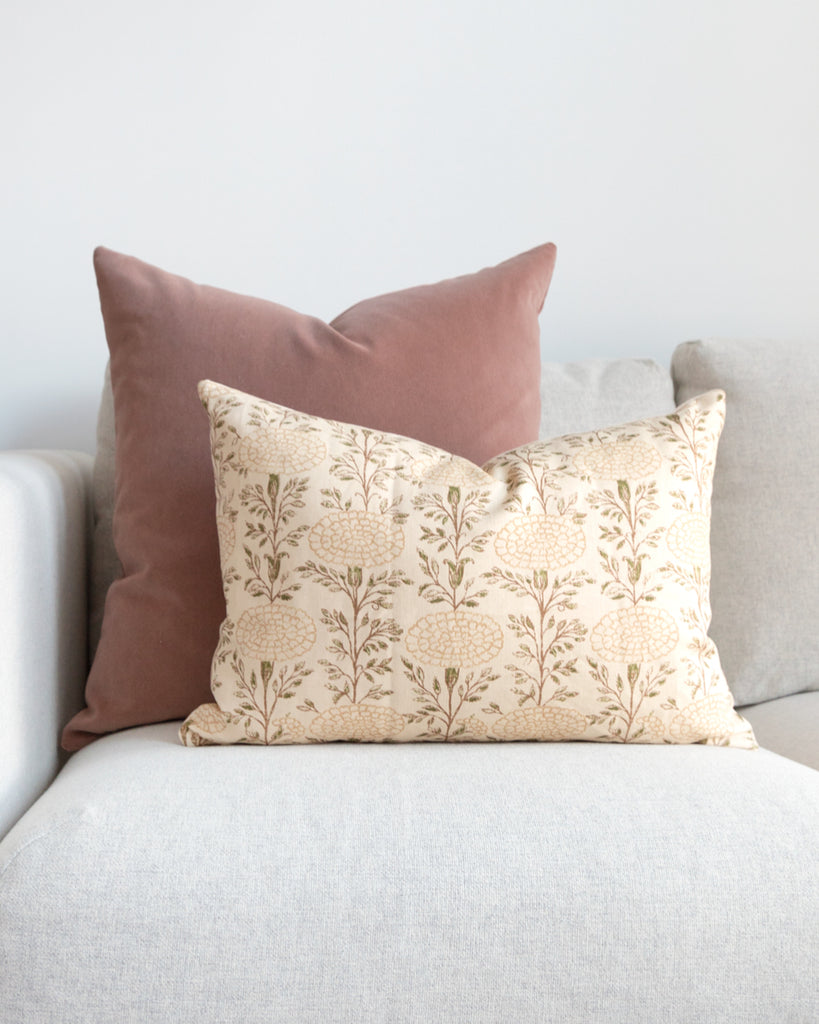  Lisa Fine Textiles muted floral print pillow sitting on white sofa with complimentary pink mohair pillow