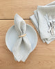 Natural beige linen napkin with plate and cutlery