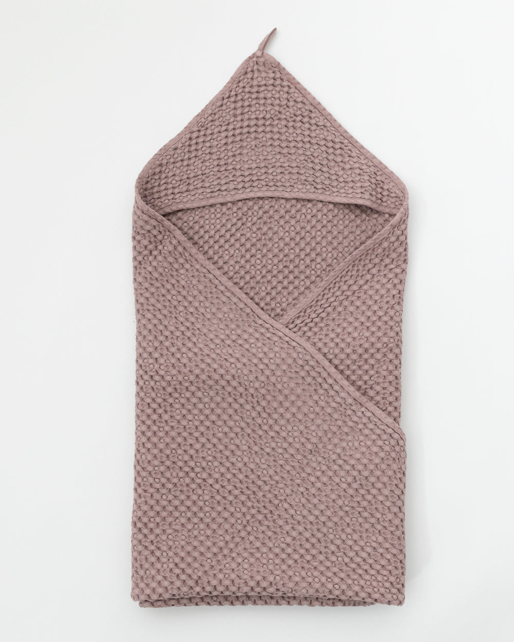 Flat folded Hooded Waffle Towel in woodrose colour.