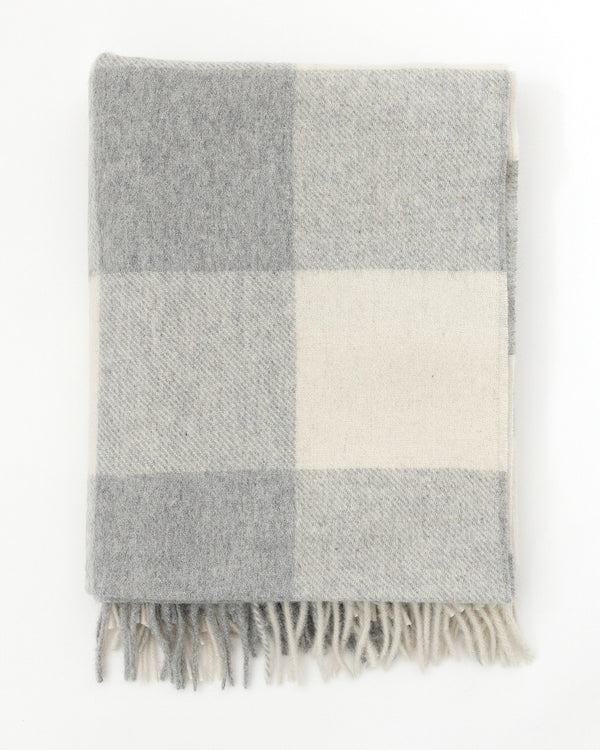 Flat folded classic grey Buffalo check blanket woven in soft wool.