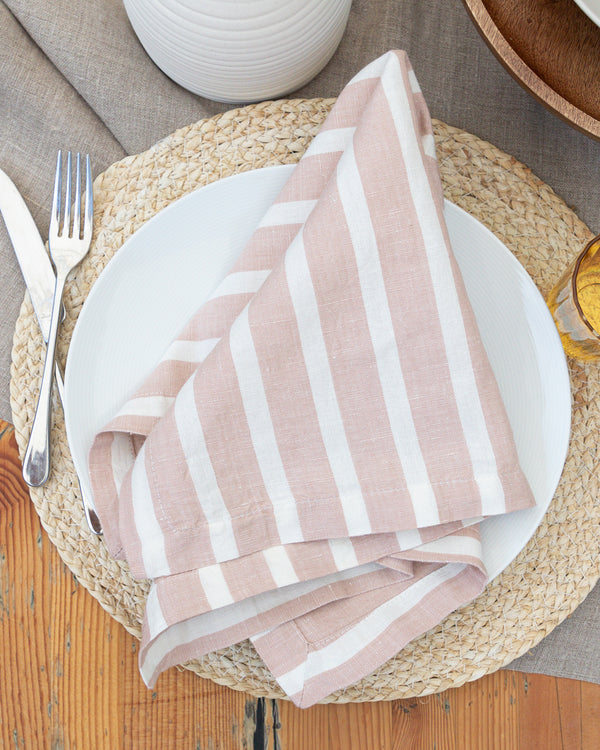 Marisol pink striped napkins sitting on table setting