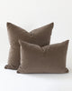 Two soft brown velvet pillows with a matte look