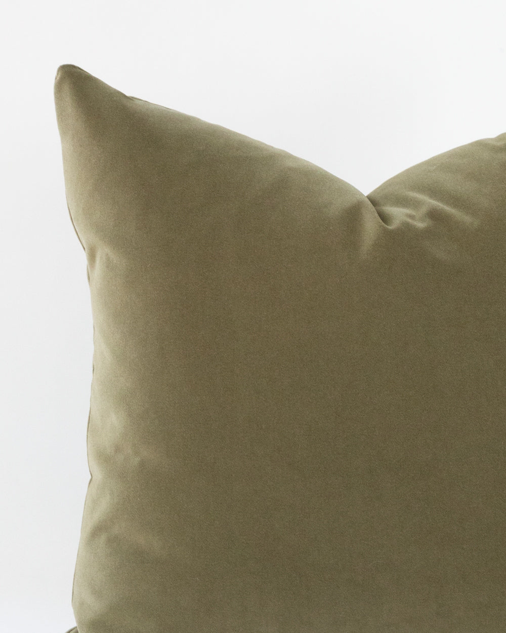 Close up detail of olive green velvet pillow