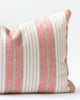 Close up detail of Pink and beige cotton striped pillow