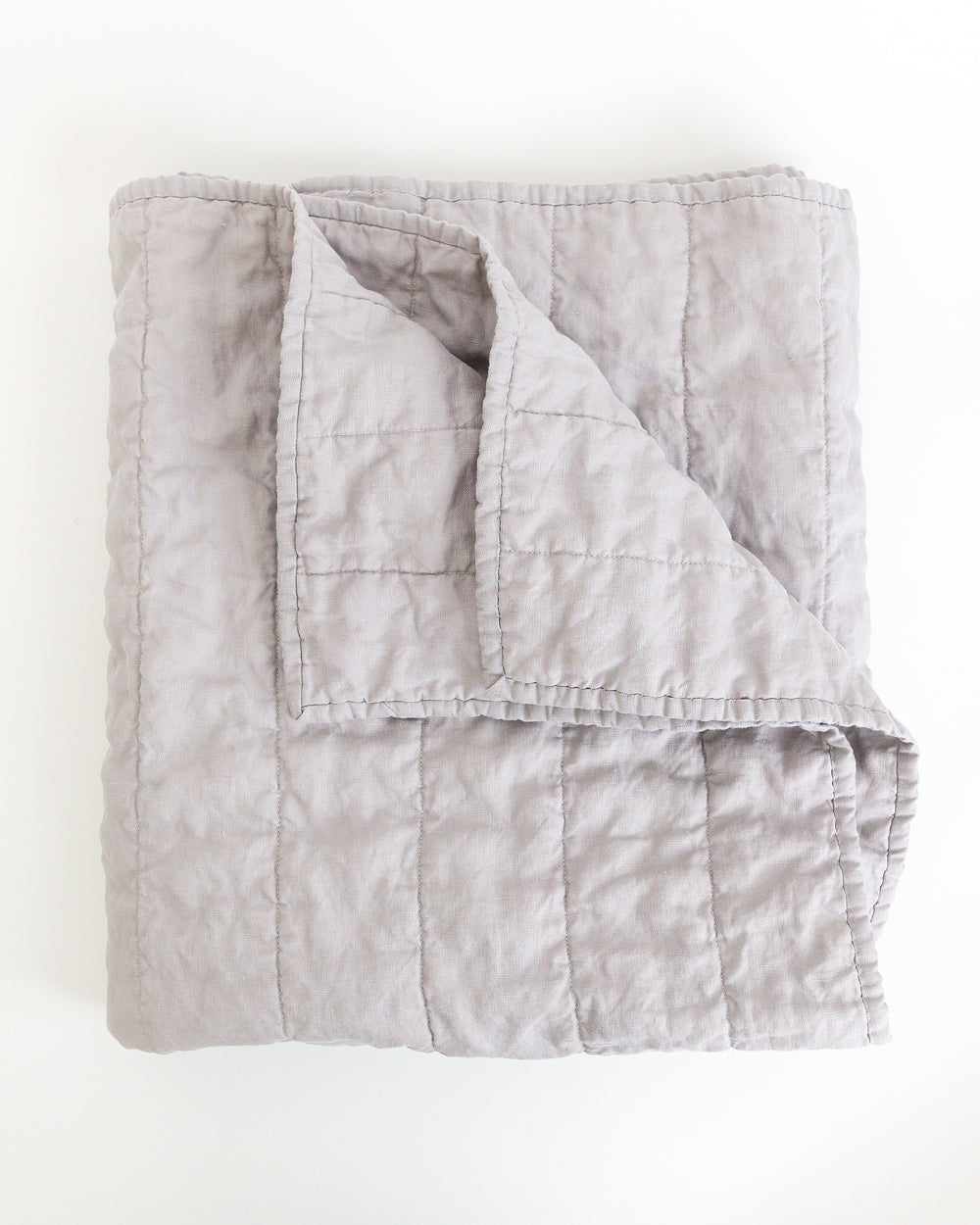 Folded classic light grey quilt
