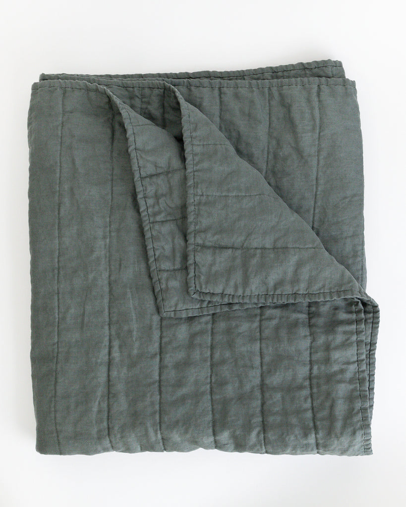 Folded dark green colour handmade Linen Quilt