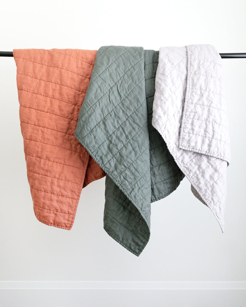 Hemme collection of handmade Linen Quilts in warm rust, classic grey and spruce green