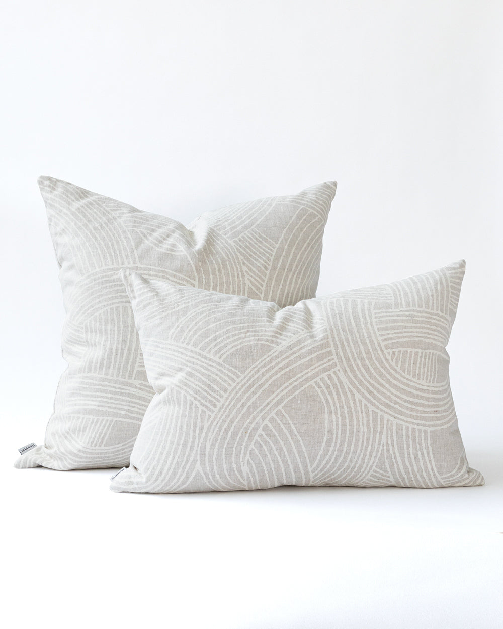 Two grey and white organic swirl pattern pillows