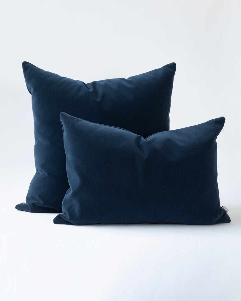 Two midnight blue velvet pillows