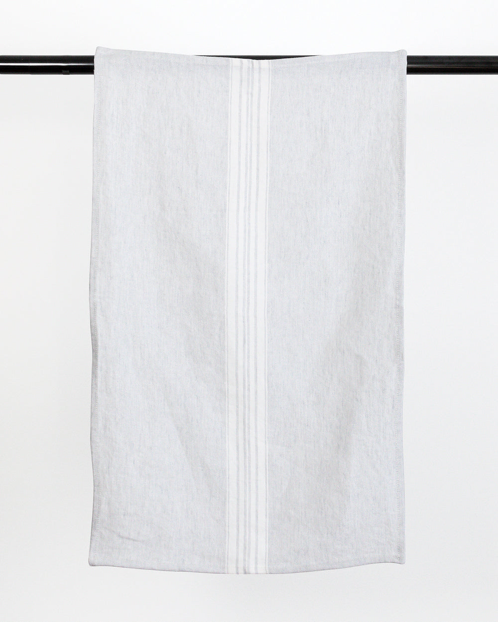 Stonewashed Striped Linen Tea Towel hanging on black rod
