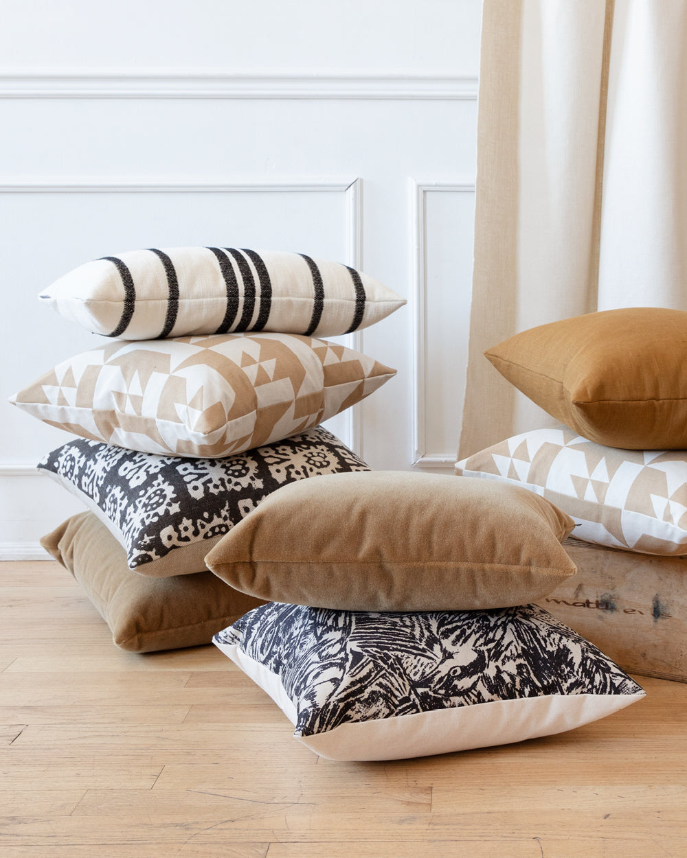 Collection of Hemme pillows stacked into piles