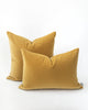 Two ochre yellow velvet pillows