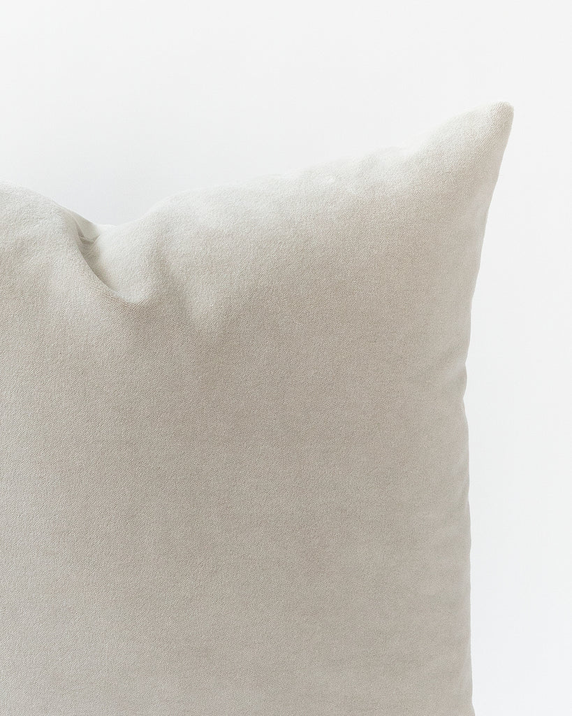 Close up detail of warm grey velvet pillow